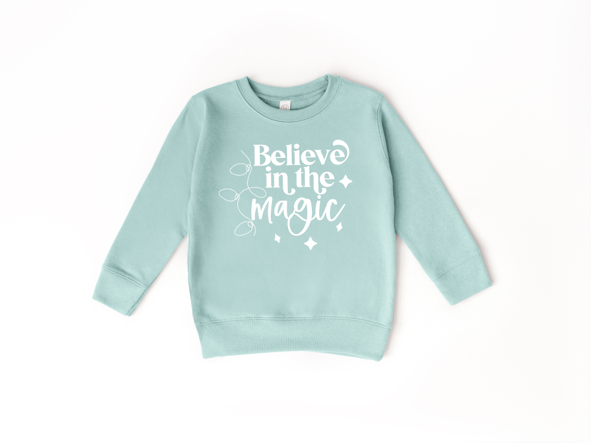 believeinthemagictoddlercrewneck.png